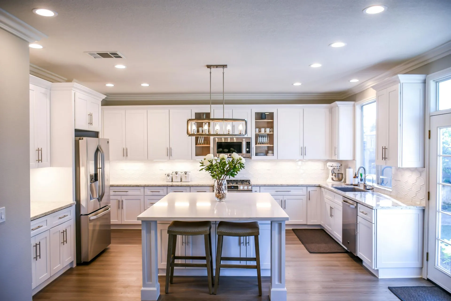 Kitchen island with a stone countertop and clean modern finishes